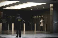 Building front with a security guard